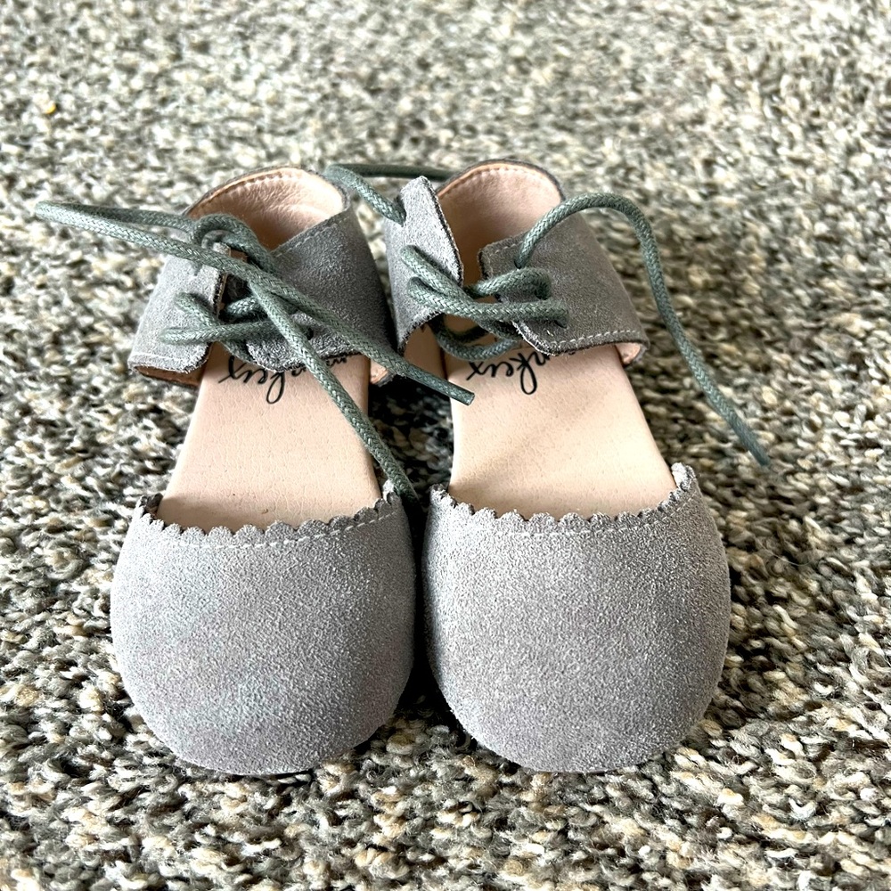 Gray suede monkey feet flats.